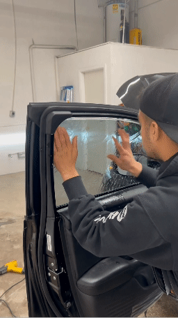 One of our technicians tinting a window.